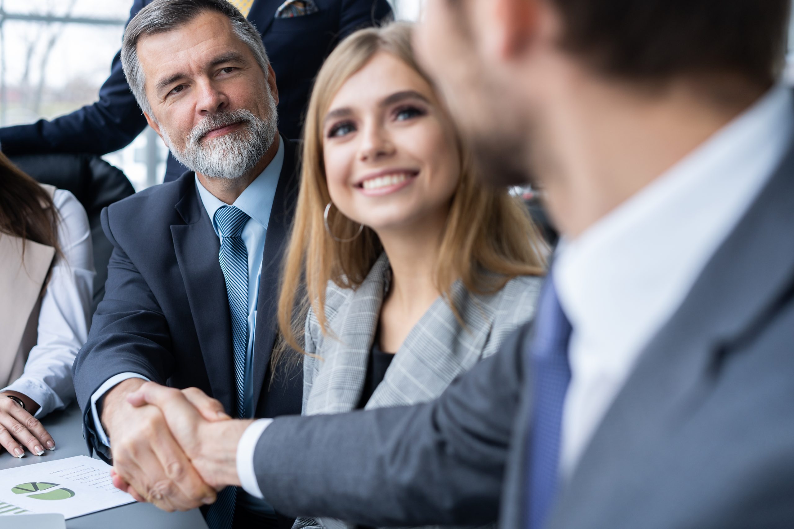 Business people shaking hands, finishing up a meeting. Handshake. Business concept